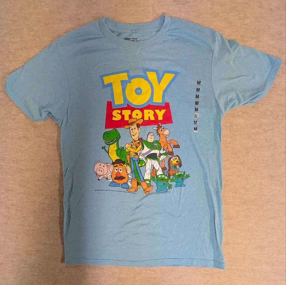 New* Toy Story Graphic T-Shirt Heathered Light Blue Main Characters Size Med/Lar